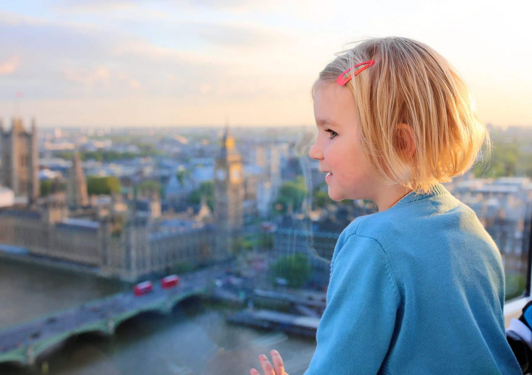 Child looking out from the London eye over London